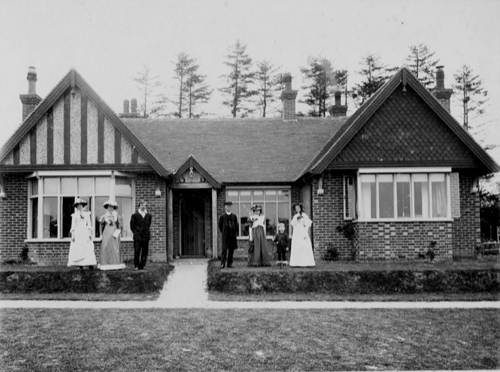 Parsoncote, now called Kent Cottage. The picture was taken in 1896, soon after the bungalow was built. The figures on the right the Rev. Sidney Sargent and family. The Reverend recieved a special permission from the Archbishop of Canterbury to live in the bungalow instead of an adjacent parsonage, The Hachetts.