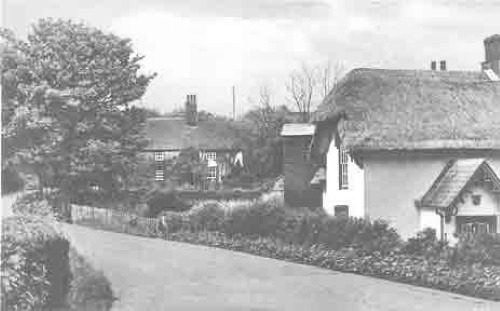 Frogham Cottage and Frogham Farm house viewed from the bottom of Barfrestone Hill.